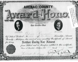 7 May 1915. Monthly attendance award. Signed by Mildred Badour (teacher), George C Glasure (Co School Comm). 1915 Hickory Island School Student Attendance Award