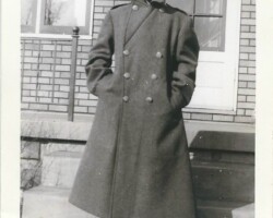 Who is this? Where? When? What do the clothes indicate? Male in pea coat