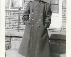 Who is this? Where? When? What do the clothes indicate? Male in pea coat