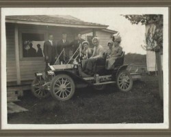 Who are these people? When is it? Where is it? What kind of auto? Men and women with old car